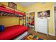 Bright bedroom with bunk beds, colorful decor, television, and a ceiling fan at 7509 Mourning Dove Cir # 204, Reunion, FL 34747