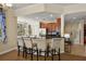 Kitchen with barstool seating, stainless steel appliances, and open layout perfect for entertaining at 7509 Mourning Dove Cir # 204, Reunion, FL 34747