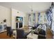 Stylish living room with elegant decor, plush seating, fireplace, and access to the covered balcony at 7509 Mourning Dove Cir # 204, Reunion, FL 34747