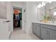 Bathroom featuring double vanity and walk in closet at 923 Colie Aly, Winter Garden, FL 34787