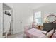 Bedroom with light-colored carpet, pink bed, and window with view to the outside at 923 Colie Aly, Winter Garden, FL 34787