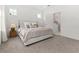 Neutral bedroom with carpet flooring, ample windows and adjoining bathroom at 923 Colie Aly, Winter Garden, FL 34787