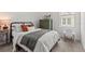 Bedroom with carpet, dark bed, and window with view to the outside at 923 Colie Aly, Winter Garden, FL 34787
