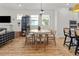 Cozy dining area with a round table, chairs, and stylish decor, perfect for Gathering meals at 923 Colie Aly, Winter Garden, FL 34787