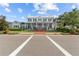 Beautiful exterior elevation of a new white home, complete with front porch at 923 Colie Aly, Winter Garden, FL 34787