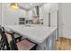 Bright kitchen with stainless steel appliances, island with seating, and modern finishes at 923 Colie Aly, Winter Garden, FL 34787
