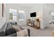 Cozy living room with ample natural light and comfortable furnishings, great for relaxation at 923 Colie Aly, Winter Garden, FL 34787