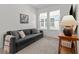 Comfortable living room with plush seating and large windows offering ample natural light at 923 Colie Aly, Winter Garden, FL 34787
