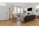 Bright and airy living room with cozy seating, fireplace, and ample natural light at 923 Colie Aly, Winter Garden, FL 34787