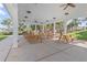Covered outdoor picnic area with multiple tables, perfect for gatherings and Gathering outings at 923 Colie Aly, Winter Garden, FL 34787