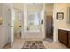 Bathroom boasts a soaking tub, glass enclosed shower and window with adjustable blinds at 930 Willow Oak Loop, Minneola, FL 34715