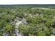 A lush, green aerial view of the condo complex surrounded by mature trees and well-maintained landscaping at 940 Douglas Ave # 159, Altamonte Springs, FL 32714