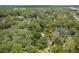 Aerial view of the condo complex featuring a community pool surrounded by lush landscaping and mature trees at 940 Douglas Ave # 159, Altamonte Springs, FL 32714