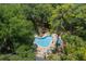 Aerial view of the community pool area with lush greenery, providing a relaxing and picturesque environment at 940 Douglas Ave # 159, Altamonte Springs, FL 32714