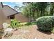 Enchanting outdoor space featuring a charming seating area surrounded by vibrant plants and greenery at 940 Douglas Ave # 159, Altamonte Springs, FL 32714