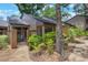 Well-maintained home exterior featuring a gated entry, mature landscaping, and a charming front yard at 940 Douglas Ave # 159, Altamonte Springs, FL 32714
