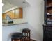Kitchen with breakfast bar, granite countertops, stainless steel microwave, and dark wood hutch at 940 Douglas Ave # 159, Altamonte Springs, FL 32714