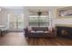 Comfortable living room with hardwood floors, fireplace, and natural light at 940 Douglas Ave # 159, Altamonte Springs, FL 32714
