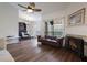 Living room with hardwood floors, fireplace, and adjacent dining area at 940 Douglas Ave # 159, Altamonte Springs, FL 32714