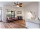Cozy living room with a fireplace, hardwood floors, and ample seating at 940 Douglas Ave # 159, Altamonte Springs, FL 32714