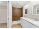 Bathroom features double vanity with granite counters, tile shower and private toilet area at 1059 Ne 130Th Ter, Silver Springs, FL 34488