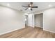 Bedroom featuring wood-look flooring, a ceiling fan, and a closet at 1059 Ne 130Th Ter, Silver Springs, FL 34488