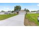 Attractive single-story home featuring an attached garage, concrete driveway, and neatly manicured lawn at 1059 Ne 130Th Ter, Silver Springs, FL 34488