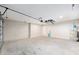 Spacious garage with a water heater and garage door opener at 1059 Ne 130Th Ter, Silver Springs, FL 34488
