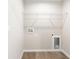 Laundry room with wood-look flooring and shelving at 1059 Ne 130Th Ter, Silver Springs, FL 34488