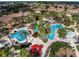 Stunning aerial view of community pool with winding water features and lush landscaping at 109 Cambria Ave, Davenport, FL 33897