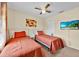 A bedroom with two twin beds, a window, and a TV at 109 Cambria Ave, Davenport, FL 33897