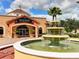 Regal Palms community center with a fountain, palm trees, and a well-maintained entrance at 109 Cambria Ave, Davenport, FL 33897