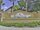 Decorative sign for Regal Palms at Highlands Reserve, surrounded by well-maintained landscaping at 109 Cambria Ave, Davenport, FL 33897