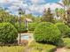 Relaxing community spa area with lush tropical landscaping and inviting design under a partly cloudy blue sky at 109 Cambria Ave, Davenport, FL 33897