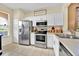 Well-equipped kitchen featuring stainless steel appliances, white cabinets, and ample counter space for cooking at 109 Cambria Ave, Davenport, FL 33897