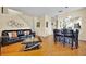 A modern living room with a leather sofa, a sleek coffee table, and an open layout at 109 Cambria Ave, Davenport, FL 33897