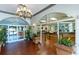 Bright lobby showcasing tile floors, elegant chandelier, and inviting entrance to welcome visitors at 109 Cambria Ave, Davenport, FL 33897