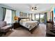 A spacious main bedroom with a large bed and balcony at 109 Cambria Ave, Davenport, FL 33897