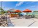 Outdoor poolside bar with shaded seating, perfect for relaxing and enjoying the community amenities at 109 Cambria Ave, Davenport, FL 33897