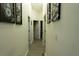 Hallway features wood-style flooring and decorations on the walls at 11761 Hatcher Cir, Orlando, FL 32824