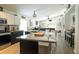 Bright kitchen featuring granite countertops, stainless appliances, and an island with barstool seating at 11761 Hatcher Cir, Orlando, FL 32824