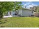 Expansive backyard featuring a well-maintained lawn, mature trees, and a serene outdoor atmosphere at 1219 Oakley St, Orlando, FL 32806