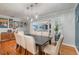 Bright dining room features a modern light fixture and hardwood flooring with an open floor plan at 1219 Oakley St, Orlando, FL 32806