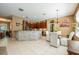 Stylish kitchen featuring stone accents, stainless steel appliances, and an adjacent breakfast area with ample seating at 127 Heatherbrooke Cir, Oviedo, FL 32765
