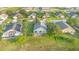 An aerial view of a single-Gathering home with a spacious backyard in a well-maintained neighborhood at 1315 Vista Del Lago Blvd, Dundee, FL 33838
