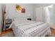 Bedroom with neutral colors, a sunflower art piece and wood floors at 1315 Vista Del Lago Blvd, Dundee, FL 33838