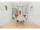Bright dining room with tiled floors and decorative chandelier at 1315 Vista Del Lago Blvd, Dundee, FL 33838