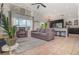 Open living area with a view of the kitchen, featuring comfortable seating and large windows for natural light at 1315 Vista Del Lago Blvd, Dundee, FL 33838