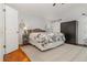 Comfortable bedroom with wood floors and accent wall at 1315 Vista Del Lago Blvd, Dundee, FL 33838