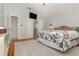 Comfortable bedroom with wood floors and view to bath at 1315 Vista Del Lago Blvd, Dundee, FL 33838
